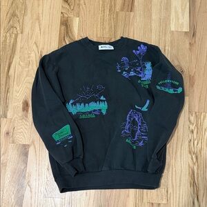 Parks Project Black Sweater with Green and Purple Graphics